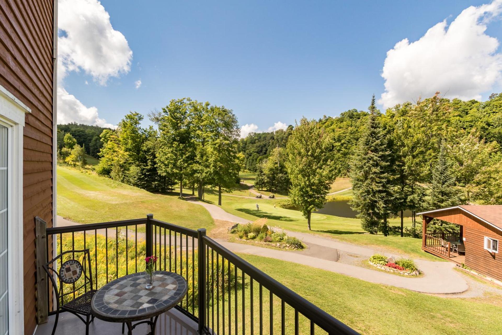 Three-Bedroom Condominium Balcony Fireplace Golf View